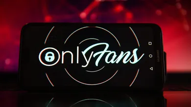 In this photo illustration the OnlyFans logo seen displayed