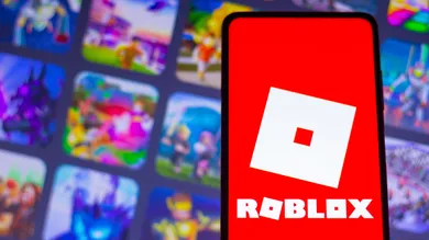 In this photo illustration, the Roblox logo seen displayed