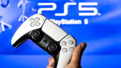 In this photo illustration, a PlayStation 5 controller seen