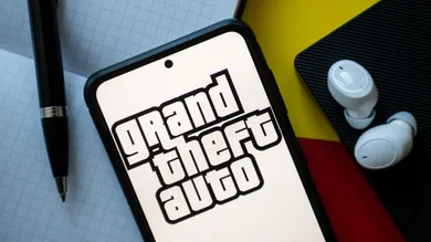 In this photo illustration a Grand Theft Auto logo seen