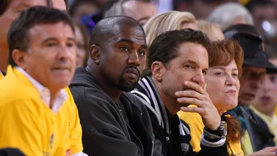 May 27, 2015; Oakland, CA, USA; Entertainer and rapper Kanye West (middle) during the first half against the Houston Rockets in