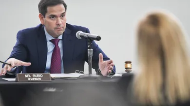 U.S. senator Marco Rubio asks Jenn Gustetic, Program Executive, SBIR/STTR Program Management Office a question during a field