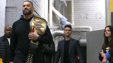 Roman Reigns walks to set for ESPNs The Pat McAfee Show Friday, March 22, 2024 from the Field House in Iowa City, Iowa.
