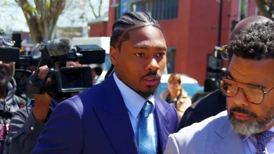 Former NE Patriot player Stefon Diggs leaves Dedham District Court and out to a waiting vehicle on Monday, May 4, 20262, as his