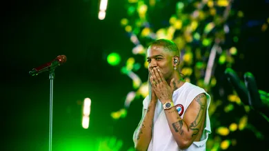 Kid Cudi gestures to the crowd after a song in his set in the Sahara tent during the Coachella Valley Music and Arts Festival in