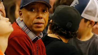 Dec 12, 2014; Phoenix, AZ, USA; American record executive and entrepreneur Russell Simmons watches an NBA game between the