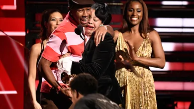 Tyler, the Creator (left) embraces his mother as he accepts the award for best rap album at the Grammy Awards.Xxx Grammys2020
