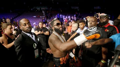 Adrien Broner, of Cincinnati, center, greets fans after defeating Khabib Allakhveriev in the 12-round WBA super lightweight