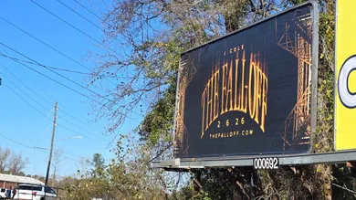 A billboard on Robeson Street near downtown Fayetteville, NC advertises the new album by rapper J. Cole, who was raised in the
