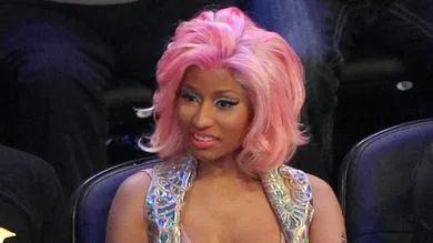 February 26, 2012; Orlando FL, USA; Recording artist Nicki Minaj (right) during the 2012 NBA All-Star Game at the Amway Center.