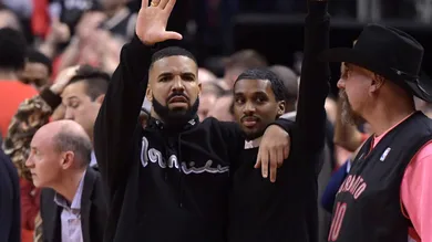 May 25, 2019; Toronto, Ontario, CAN; Recording artist Drake waves toward the Milwaukee Bucks bench in the closing moments of