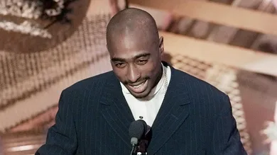 Tupac Shakur presents an award at the 38th Annual Grammy Awards at the Shrine Auditorium.