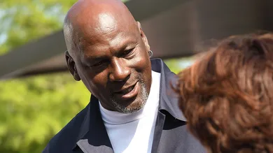 Michael Jordan takes the time to pose for a few photos and greet spectators and friends outside of The Michael Jordan Family