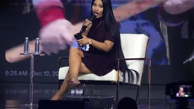 Nicki Minaj takes the stage with Erika Kirk at the Phoenix Convention Center during the final day of AmericaFest on Dec. 21,