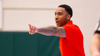 Pike High School head coach Jeff Teague gestures during the first half of a Metropolitan Interscholastic Conference championship