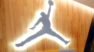 A hallway of the locker room, leading to the coaches office features an Air Jordan logo. The Marquette mens' basketball team