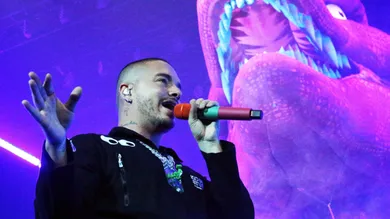 Reggaeton singer J Balvin is surrounded by dinosaurs on stage during his Sunday night show at the Don Haskins Center.3 J