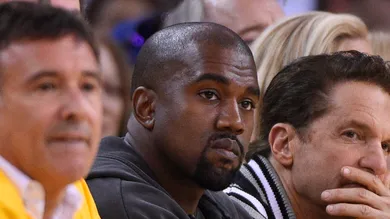 May 27, 2015; Oakland, CA, USA; Entertainer and rapper Kanye West (middle) during the first half against the Houston Rockets in