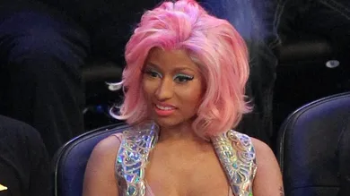 February 26, 2012; Orlando FL, USA; Recording artist Nicki Minaj (right) during the 2012 NBA All-Star Game at the Amway Center.