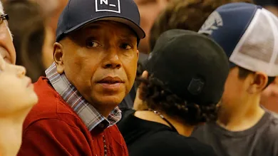 Dec 12, 2014; Phoenix, AZ, USA; American record executive and entrepreneur Russell Simmons watches an NBA game between the