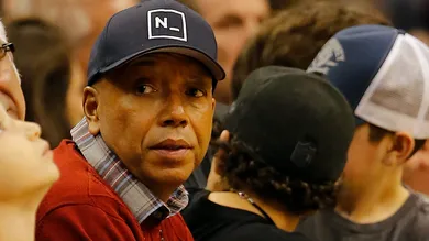 Dec 12, 2014; Phoenix, AZ, USA; American record executive and entrepreneur Russell Simmons watches an NBA game between the