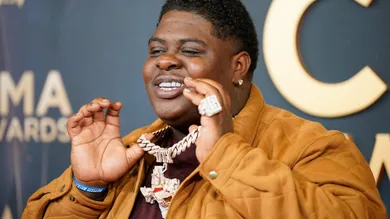 BigXthaPlug arrives on the red carpet for the 59th Annual CMA Awards at Music City Center in Nashville, Tenn., Wednesday, Nov.
