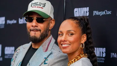Swizz Beatz and Alicia Keys walk the red carpet during the opening for Giants: Art from the Dean Collection of Swizz Beatz and