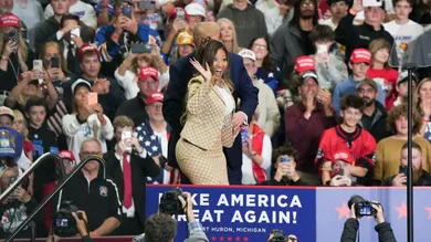 President Donald Trump invites Rapper Nicki Minaj onstage during a midterm rally at McMorran Place Arena in Port Huron on