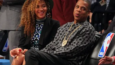 Apr 1, 2014; Brooklyn, NY, USA; Beyonce and Jay-Z watch the game between the Brooklyn Nets and the Houston Rockets during the