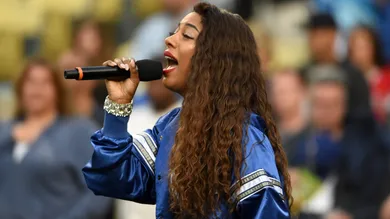 May 16, 2016; Los Angeles, CA, USA; Recording artist Victoria Monet sings the national anthem before an interleague MLB game