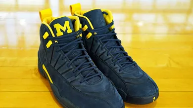 Image Via <a href='https://sneakernews.com/2018/03/20/psny-air-jordan-12-michigan-release-info/' rel="nofollow noopener" target='_blank'>SN</a>