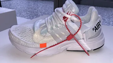 Image Via <a href='https://sneakernews.com/2018/05/22/off-white-nike-presto-white-black-release-info/' rel="nofollow noopener" target='_blank'>SneakerNews</a>