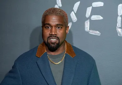 : Kanye West attends the the Versace fall 2019 fashion show at the American Stock Exchange Building in lower Manhattan on December 02, 2018 in New York City