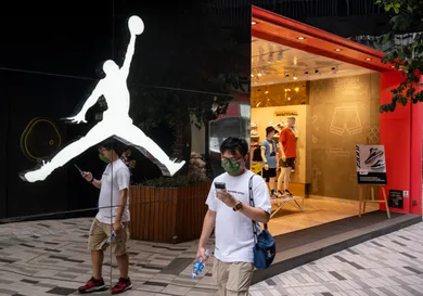 A pedestrian walks past the American sportwear brand and