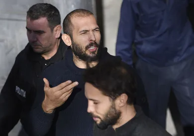 Andrew Tate leaves court after his trial in Romania