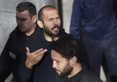 Andrew Tate leaves court after his trial in Romania