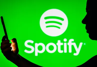 In this photo illustration, a woman's silhouette holds a