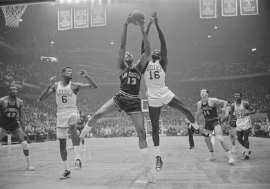 Wilt Chamberlain and Bill Russell Fighting for Rebound