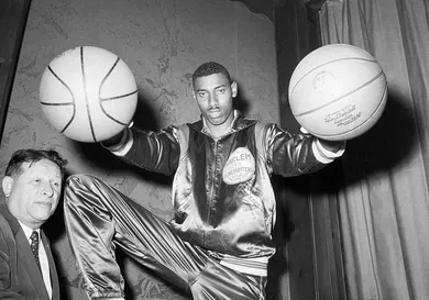Wilt Chamberlain Holding Two Basketballs