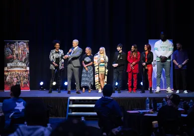 WWE stars Alicia Taylor, Cody Rhodes, Gabi Butler, Liv Morgan, Evan St. Amand, Carmella, Bayley, Omos and Finn Balor with 20 Make-A-Wish kids at Universal Studios Hollywood