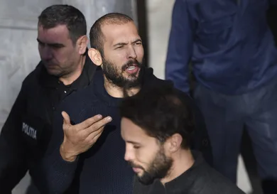 Andrew Tate leaves court after his trial in Romania