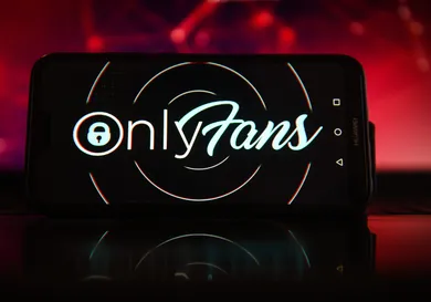 In this photo illustration the OnlyFans logo seen displayed
