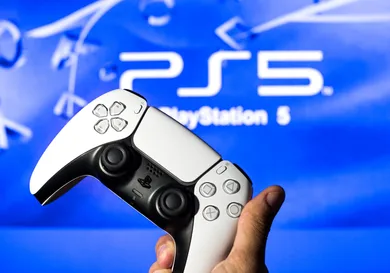 In this photo illustration, a PlayStation 5 controller seen