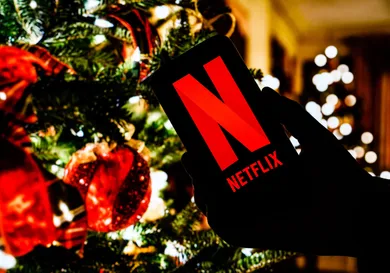 In this photo illustration the Netflix logo seen displayed