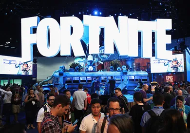 Game enthusiasts and industry personnel visit the 'Fortnite' exhibit during the Electronic Entertainment Expo E3 at the Los Angeles Convention Center on June 12, 2018 in Los Angeles, California.