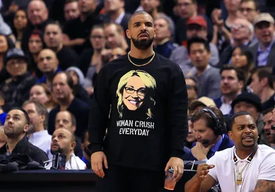 Drake looks on from his courtside seat during the second half of an NBA game between the Golden State Warriors and the Toronto Raptors at Air Canada Centre on November 16, 2016 in Toronto, Canada.