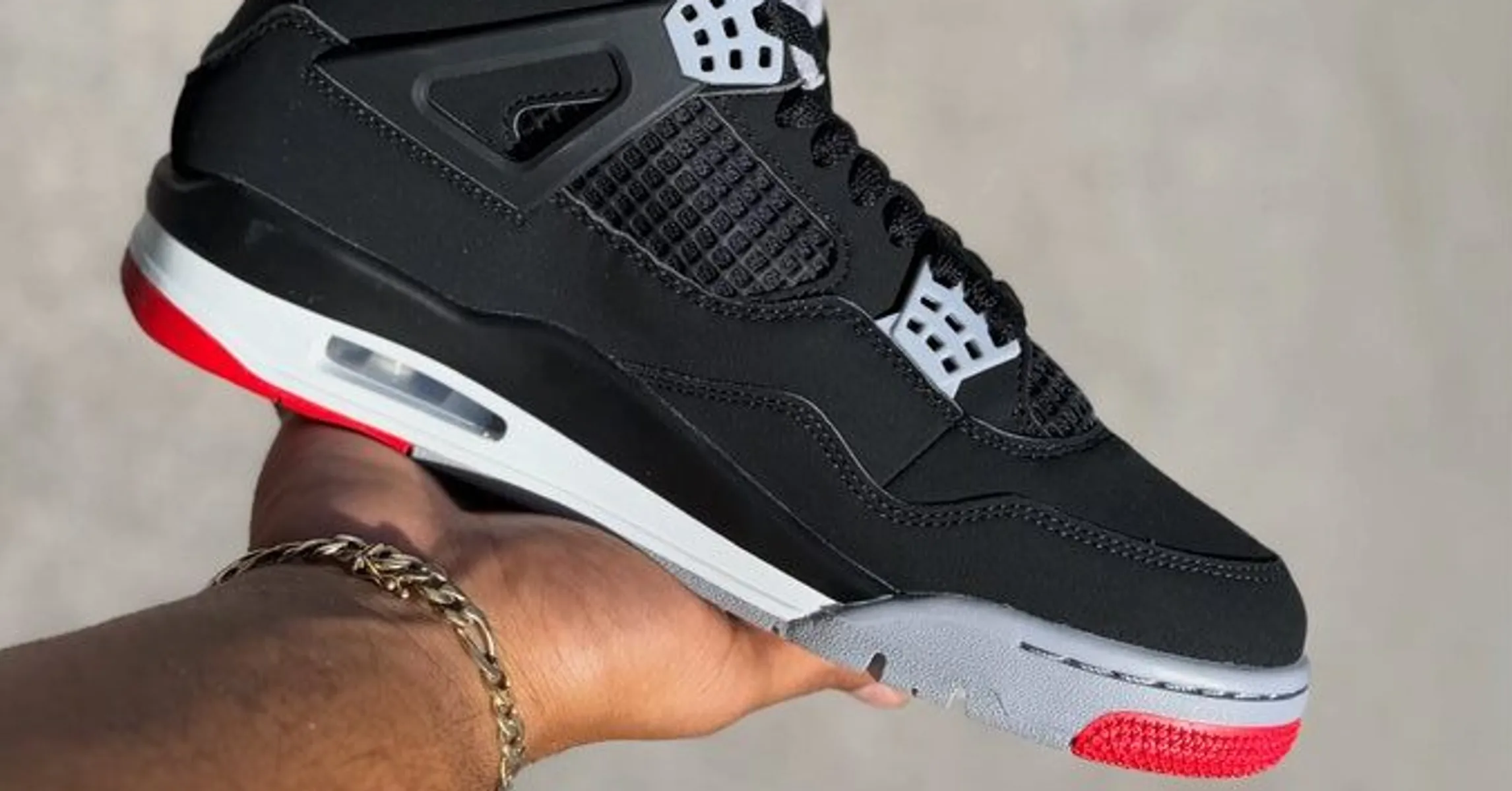 In-Hand Images Unveil The Upcoming Air Jordan 4 “Bred”