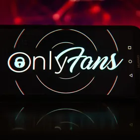In this photo illustration the OnlyFans logo seen displayed