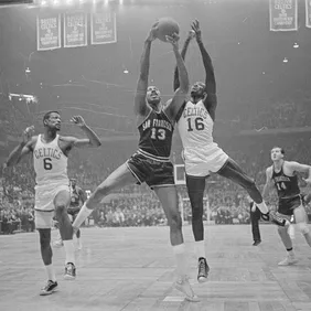 Wilt Chamberlain and Bill Russell Fighting for Rebound