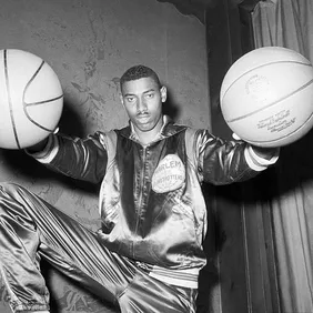 Wilt Chamberlain Holding Two Basketballs